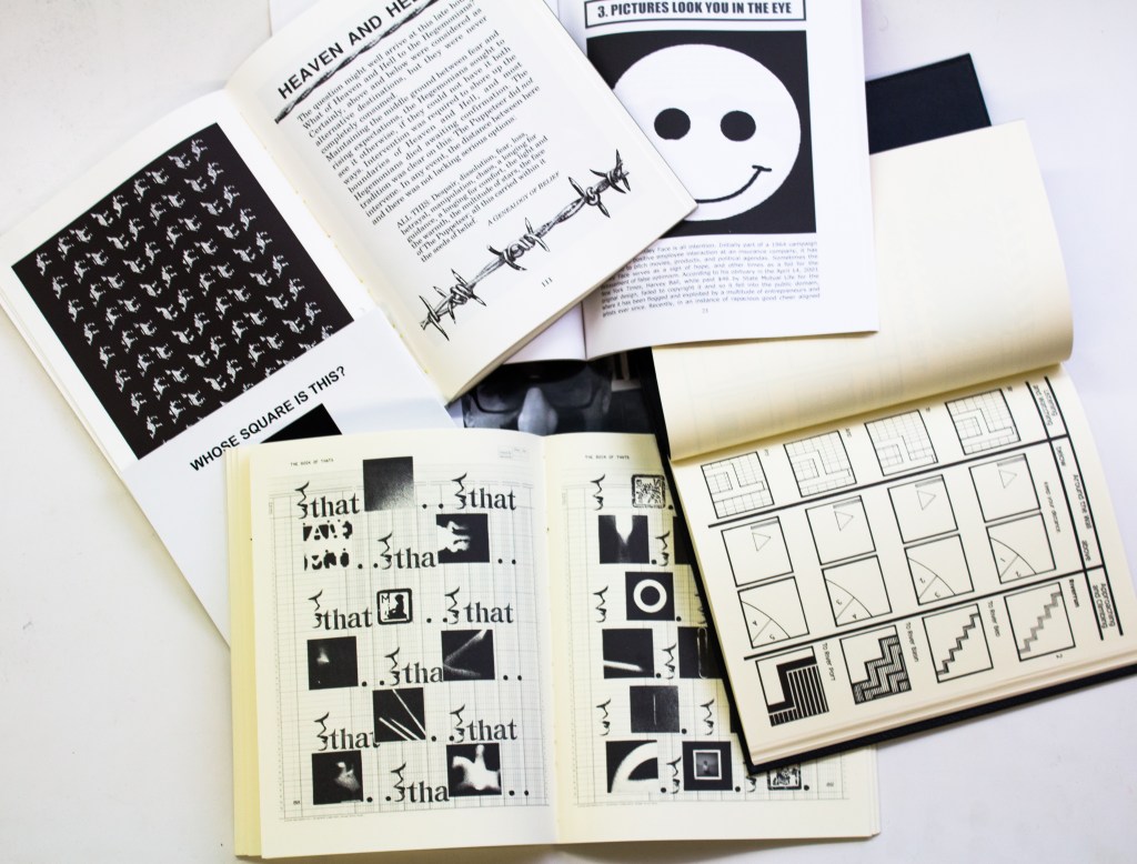 a spread of Paul's books - all open to black and white spreads of image and texts